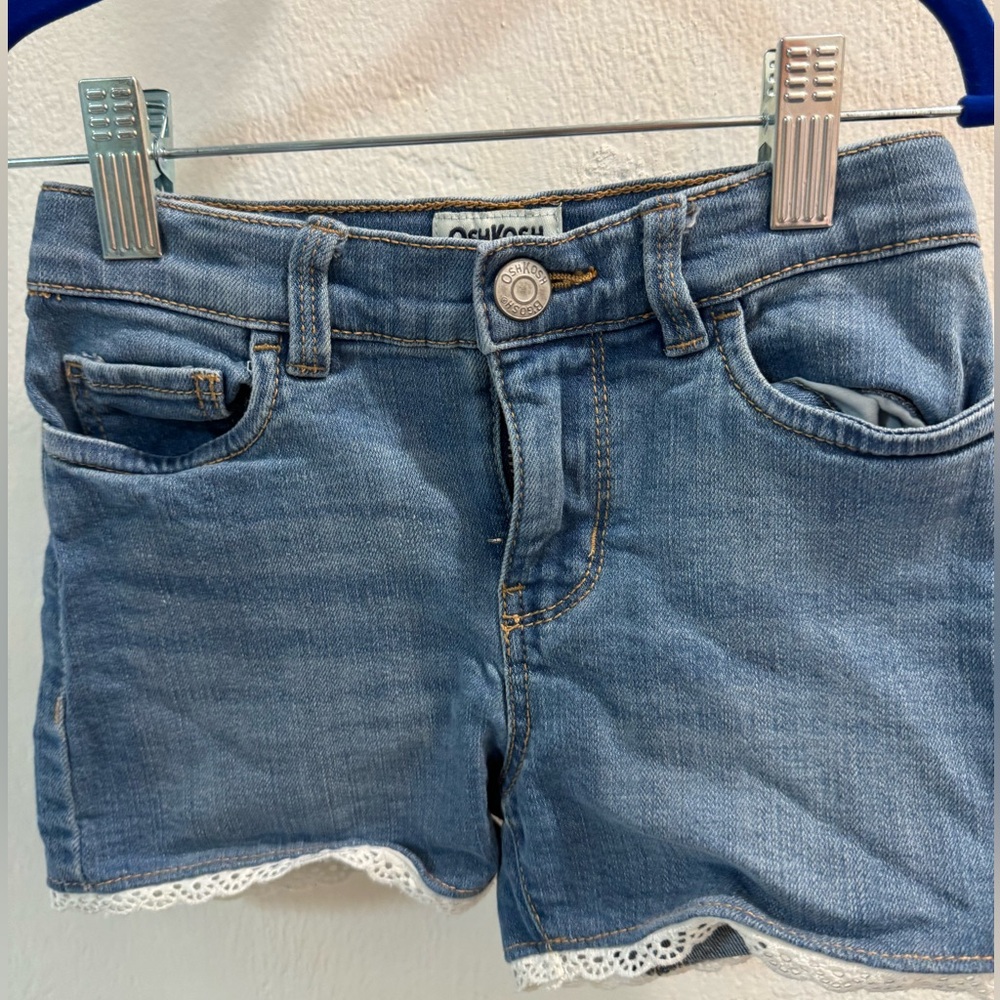 Oshkosh soft stretch Jean shorts with lace embellishment.